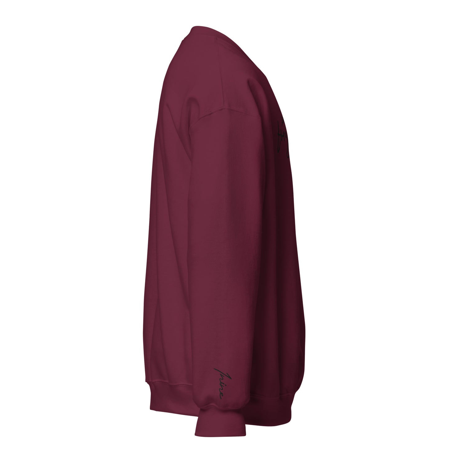 Side view of right wrist embroidery reading ‘1NINE’ in cursive on maroon Christian sweatshirt inspired by 1 John 1:9