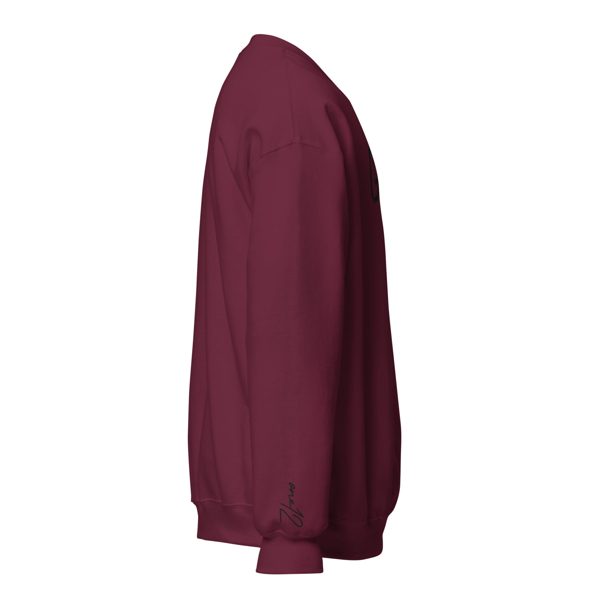 Right side view of maroon Child of God embroidered crewneck sweatshirt with cursive one12 wrist embroidery, inspired by John 1:12