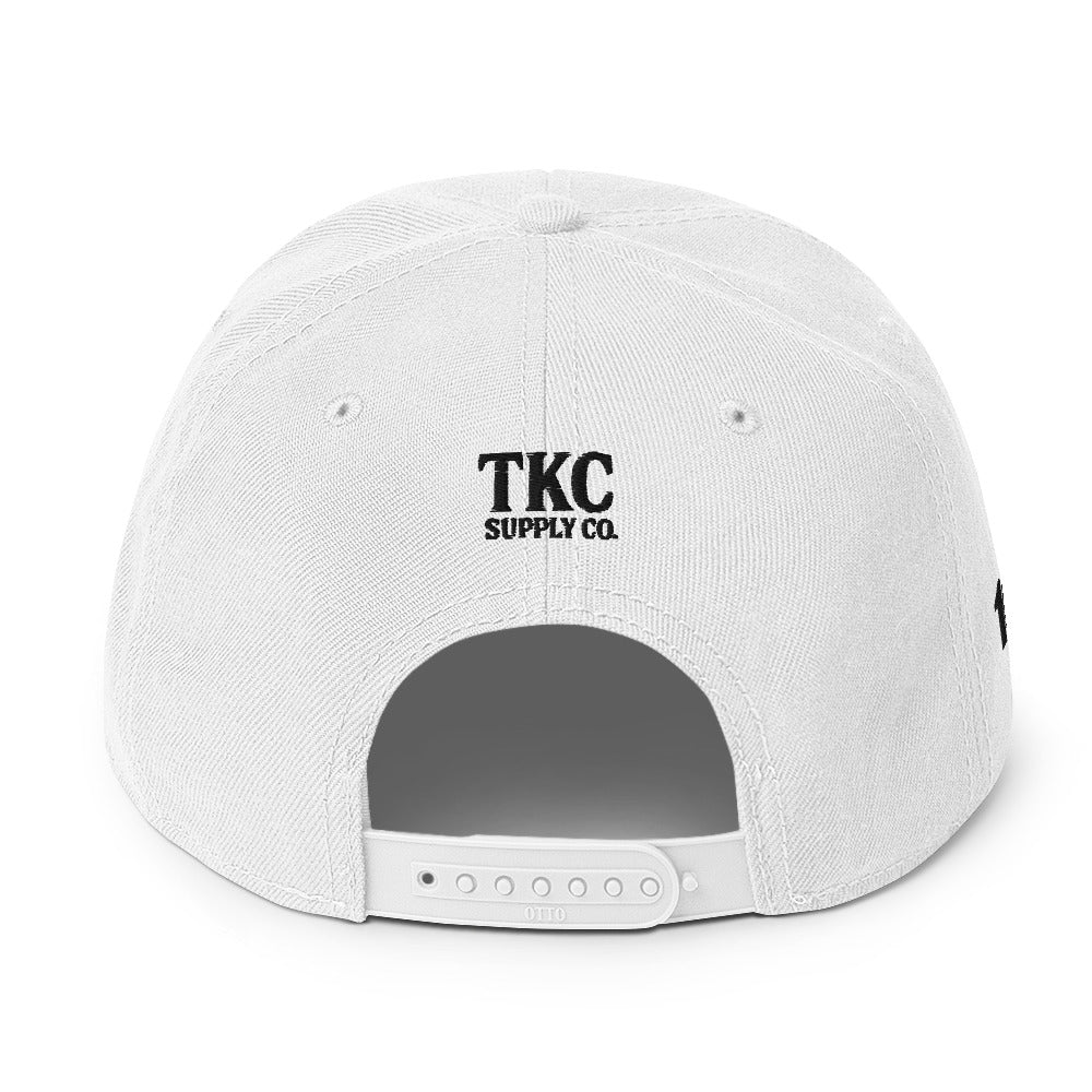 Back of white Christian hat with TKC Supply Co. logo above snap