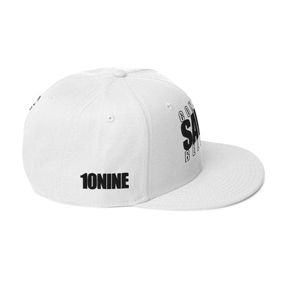 Side view of white snapback hat with 10NINE logo on right panel