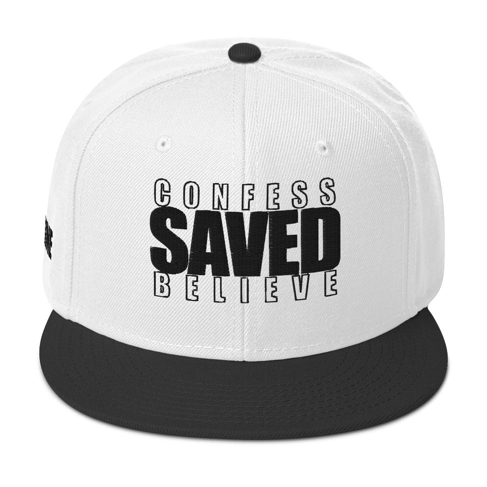 Black and white Christian snapback hat with Confess Believe SAVED text on front