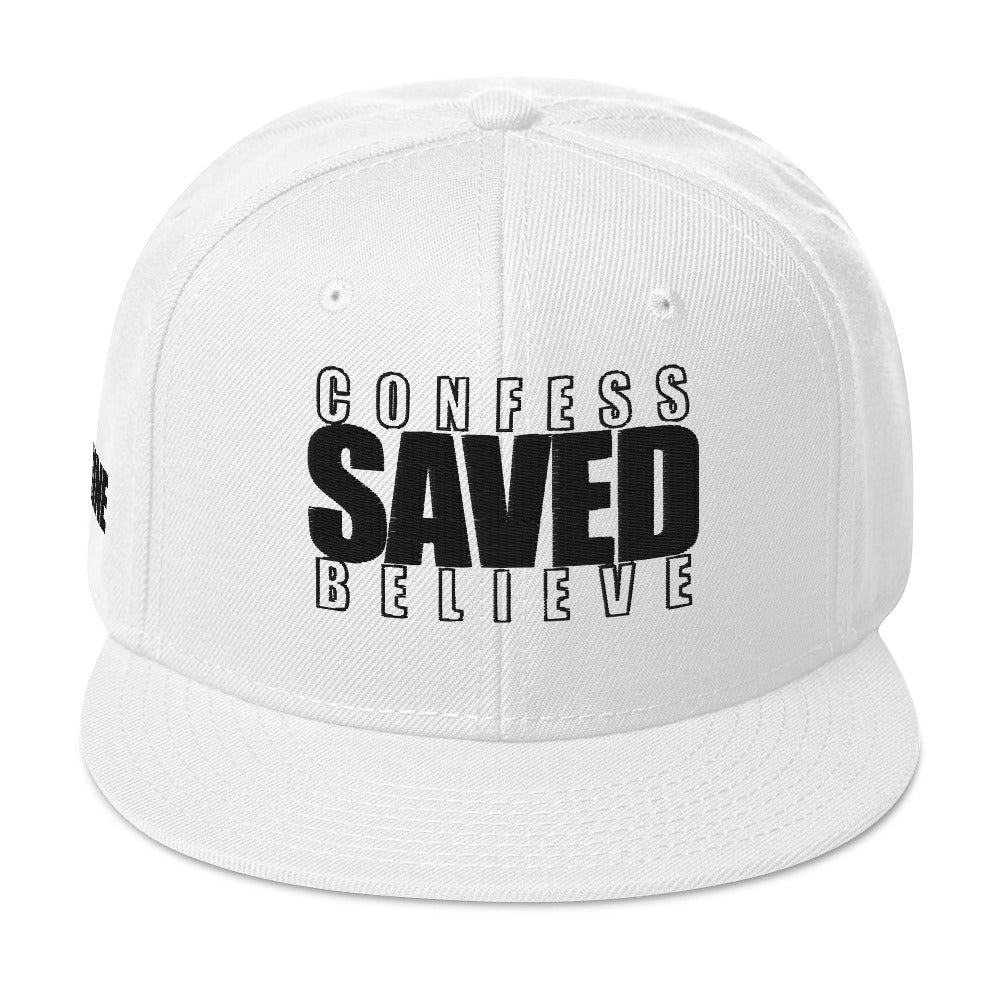 White Christian snapback hat with Confess Believe SAVED text on front